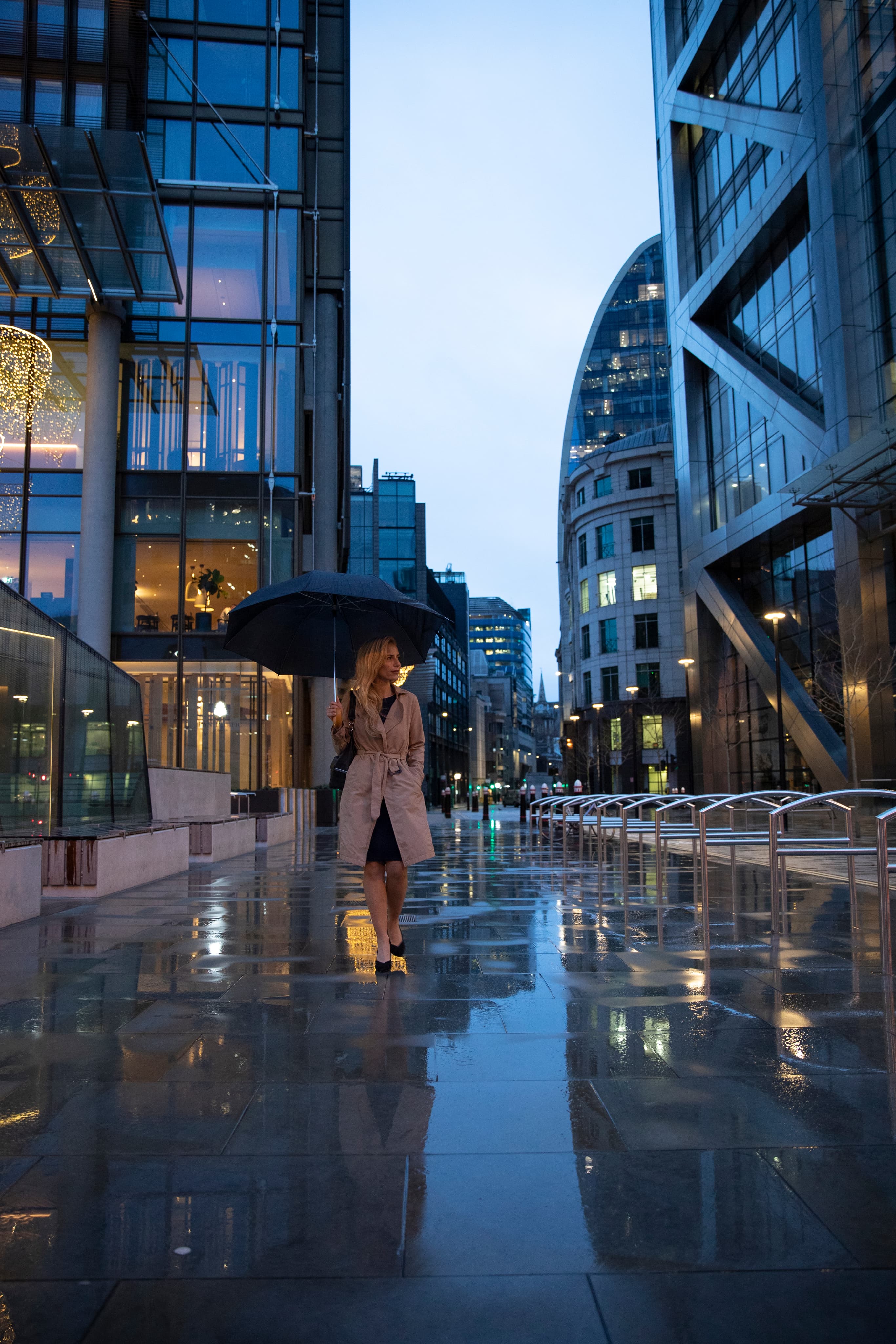 Professional in a city with umbrella